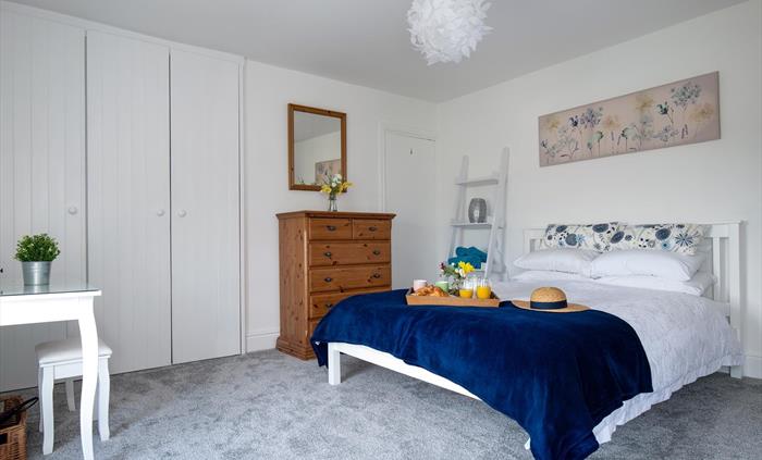 This photograph shows the spaciousness of the main bedroom